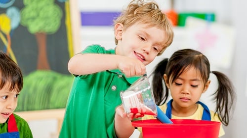 children measuring ingredients