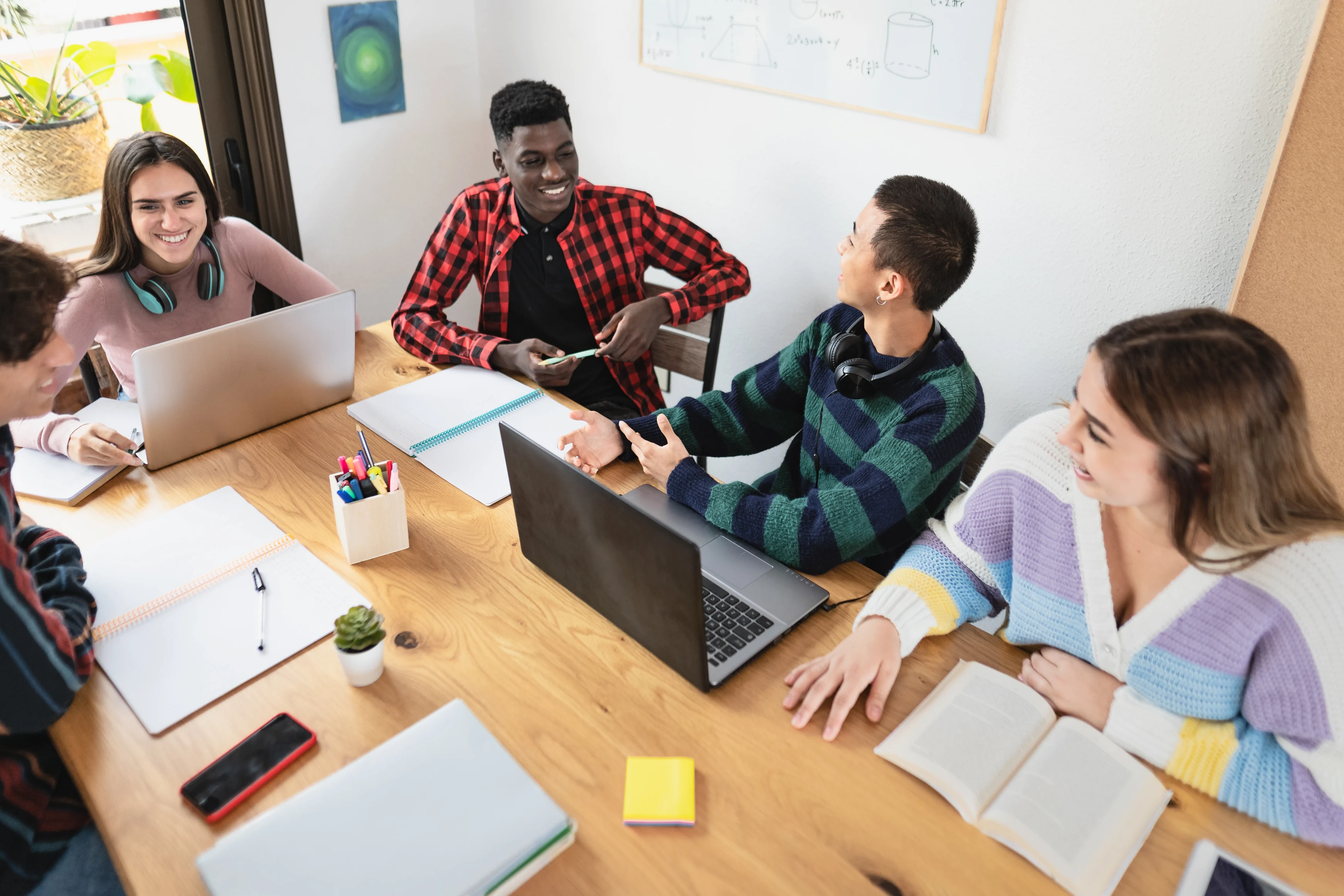 diverse group of students working on a project together